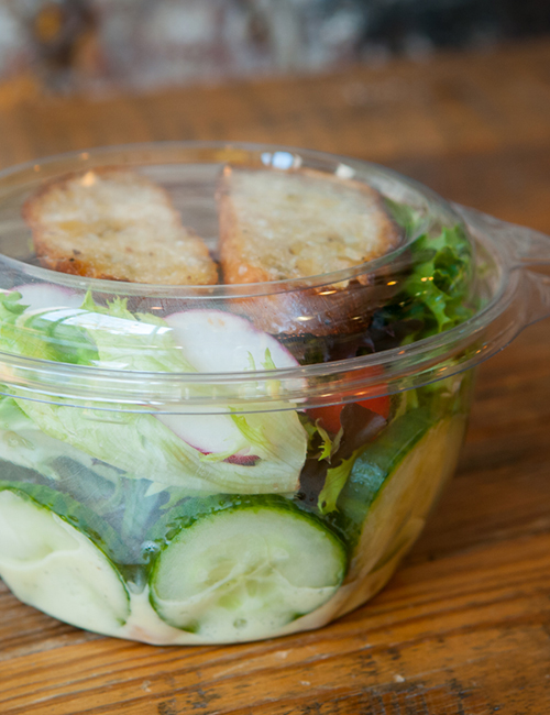 tasty little salad in the to-go plastic container