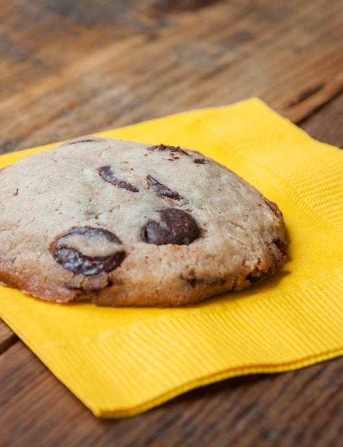 lucettegrace chocolate chunk cookie on a yellow napkin
