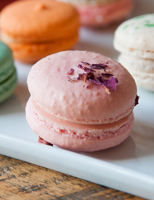 closeup of the rose macaron with dried rose petals on top
